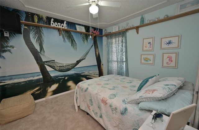 carpeted bedroom with ceiling fan and a textured ceiling