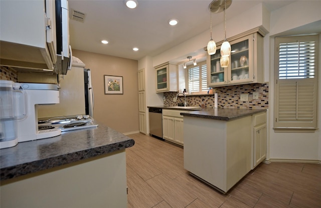 kitchen with dishwasher, hanging light fixtures, tasteful backsplash, white cabinetry, and sink