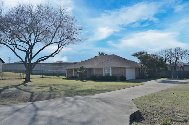 view of front facade with a front lawn and a garage