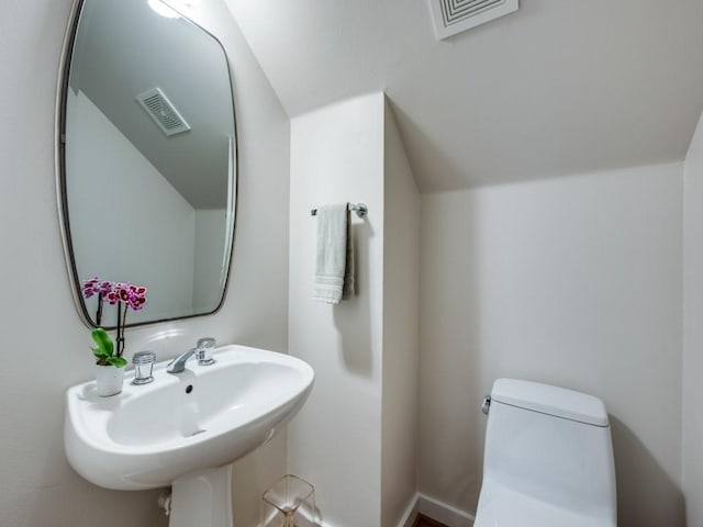 bathroom featuring sink and toilet