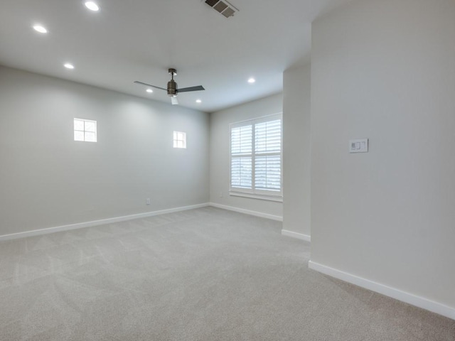 carpeted empty room featuring ceiling fan