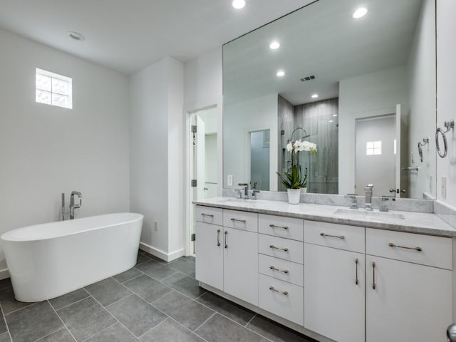 bathroom with separate shower and tub and vanity