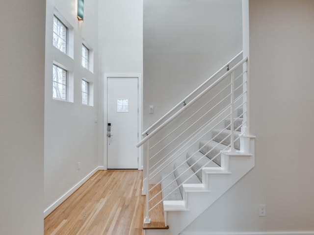 foyer entrance with light hardwood / wood-style floors and plenty of natural light