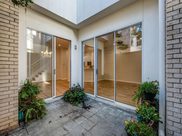 doorway to property with a patio area