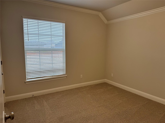 unfurnished room with vaulted ceiling, ornamental molding, and carpet flooring