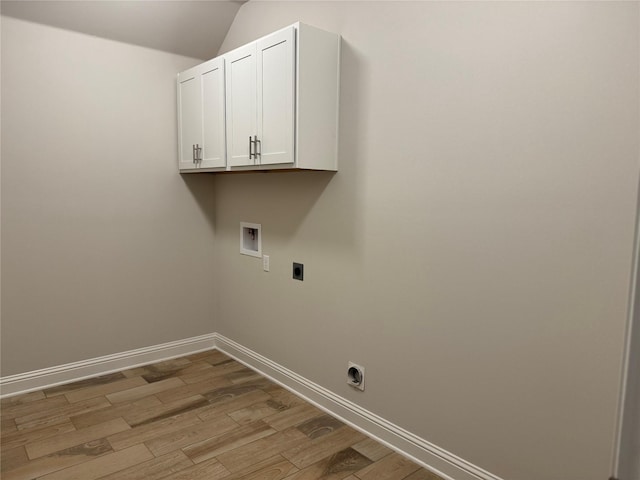 laundry area with cabinets, hookup for a washing machine, light hardwood / wood-style floors, and hookup for an electric dryer