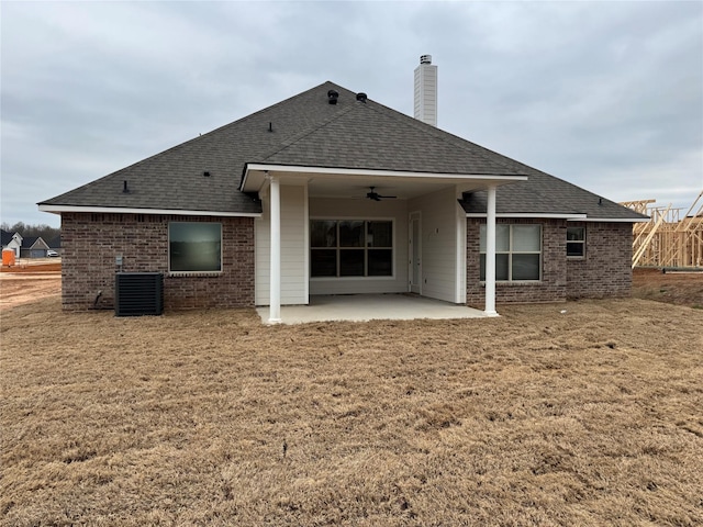 back of house featuring a patio, a lawn, ceiling fan, and central air condition unit