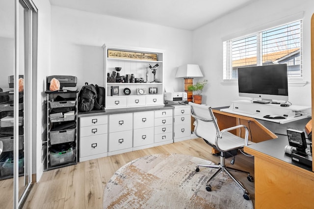 office area with light hardwood / wood-style flooring