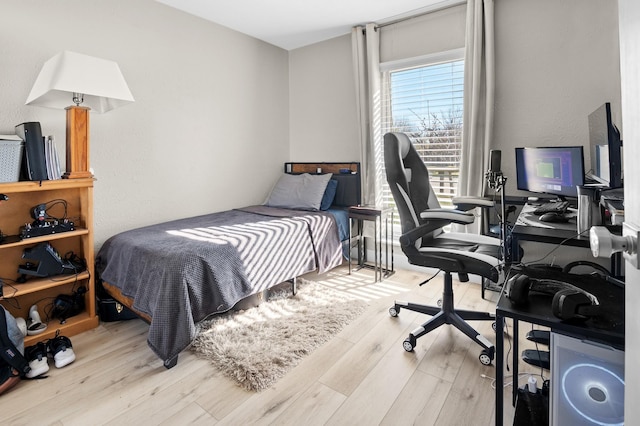 bedroom featuring light wood-type flooring