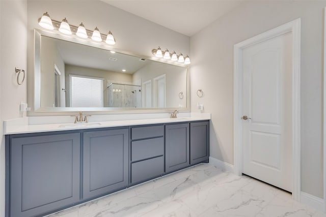 bathroom with vanity and a shower with shower door