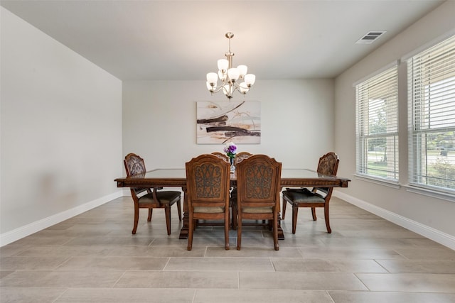 dining space featuring a chandelier