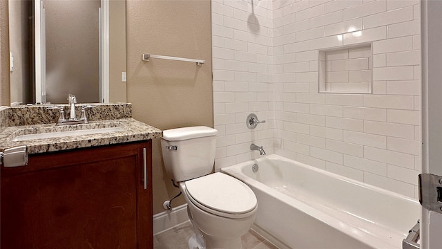 full bathroom featuring tiled shower / bath combo, vanity, tile patterned floors, and toilet