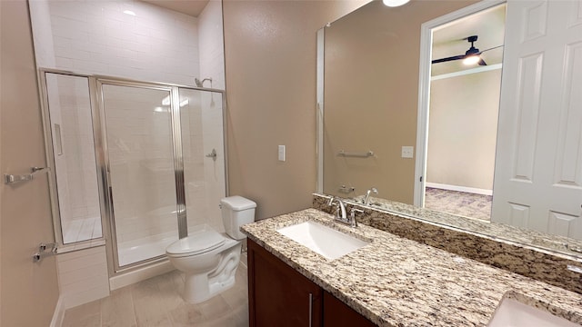 bathroom with hardwood / wood-style flooring, vanity, toilet, and a shower with shower door