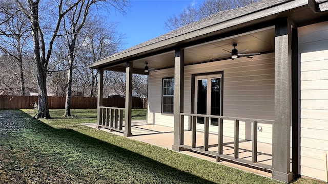 view of yard with ceiling fan and a patio area