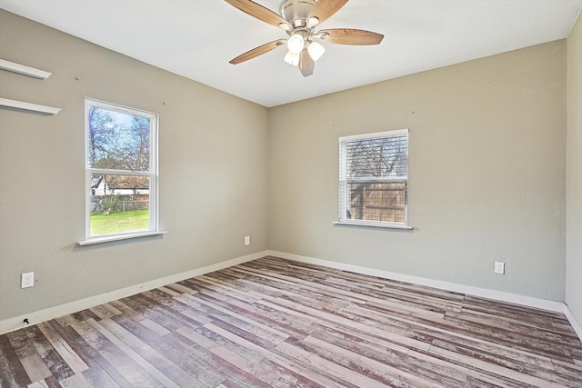 unfurnished room featuring ceiling fan and light hardwood / wood-style flooring