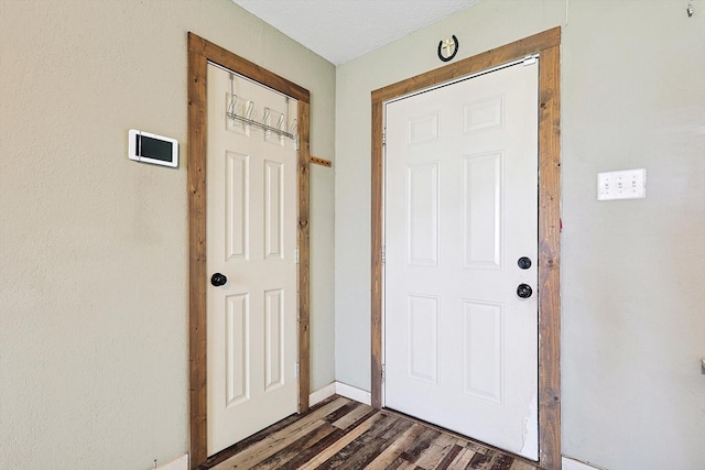 doorway to outside with dark wood-type flooring