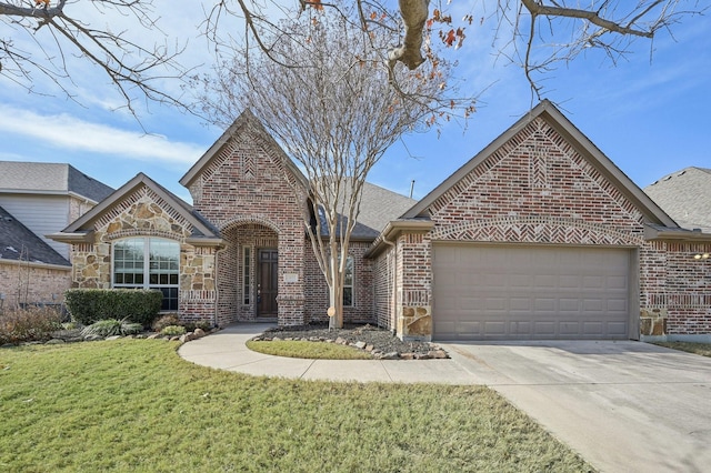 view of front of house with a garage and a front lawn