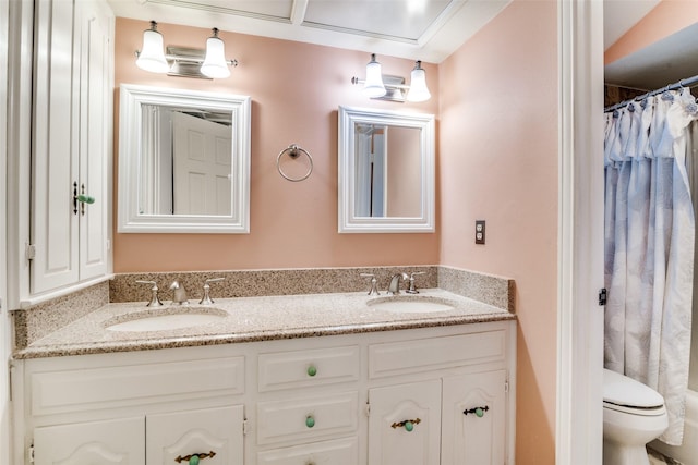 bathroom featuring vanity and toilet