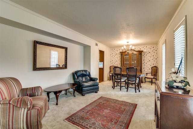 living room featuring an inviting chandelier, light colored carpet, and ornamental molding