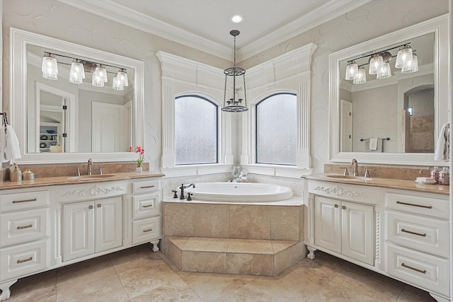 bathroom featuring ornamental molding, tiled tub, and vanity