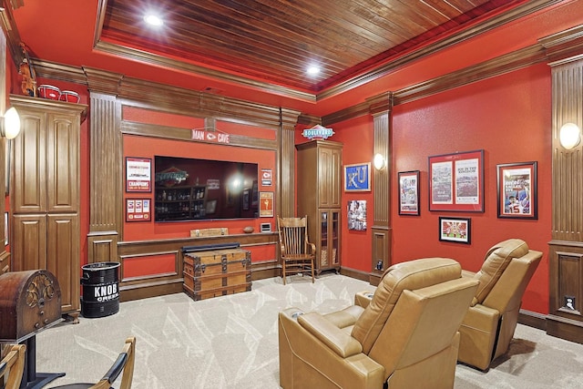 cinema with light colored carpet and crown molding