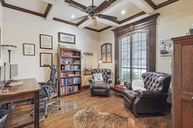 office space featuring wood-type flooring, beamed ceiling, ceiling fan, crown molding, and coffered ceiling