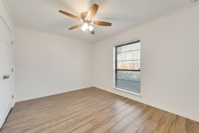 spare room with ceiling fan, crown molding, and light hardwood / wood-style flooring