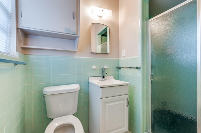 bathroom featuring tile walls, walk in shower, vanity, and toilet