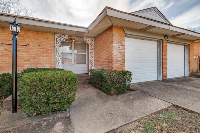 doorway to property featuring a garage