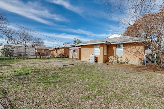 back of house with a lawn