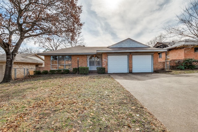 view of front of home with a front lawn and a garage