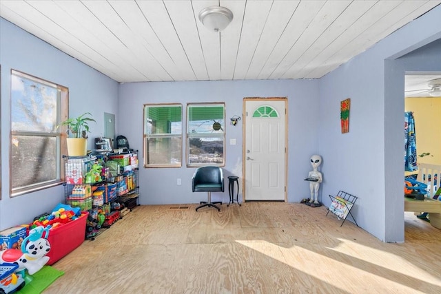 recreation room featuring wood ceiling and plenty of natural light