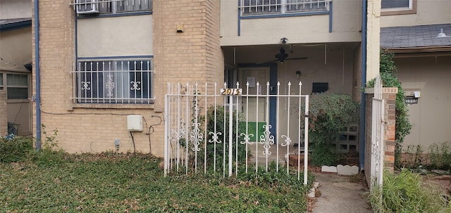 property entrance with ceiling fan