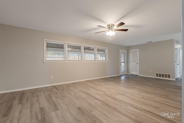 unfurnished room with ceiling fan and light wood-type flooring