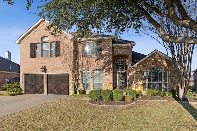 front facade featuring a front yard and a garage