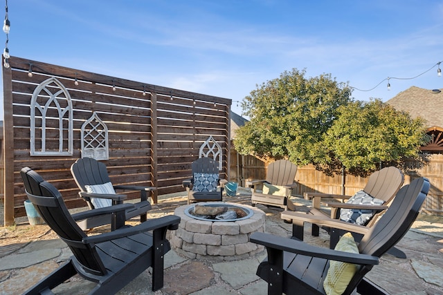 view of patio with a fire pit