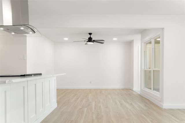 interior space featuring ceiling fan and light hardwood / wood-style flooring