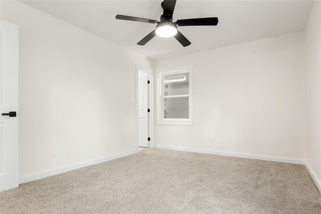 spare room featuring ceiling fan and carpet flooring