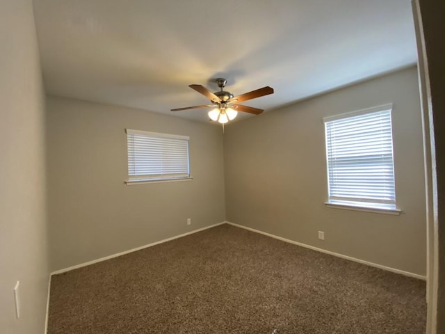 carpeted empty room with ceiling fan