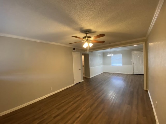 spare room with ceiling fan with notable chandelier, a textured ceiling, ornamental molding, and dark wood-type flooring