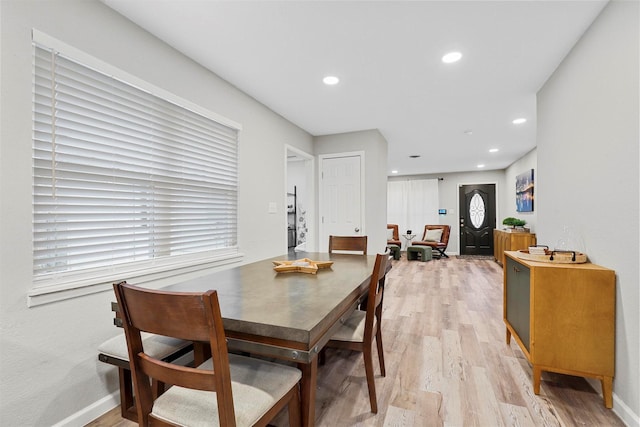 dining space featuring light wood-type flooring