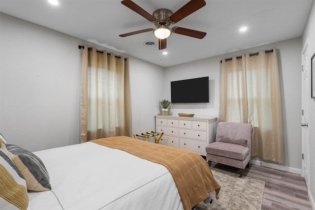 bedroom featuring ceiling fan and light hardwood / wood-style flooring