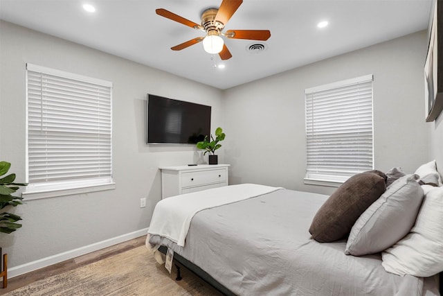 bedroom featuring ceiling fan and hardwood / wood-style floors