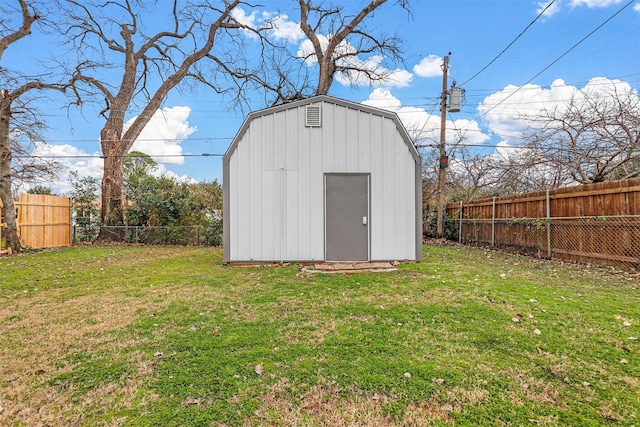 view of outbuilding featuring a lawn