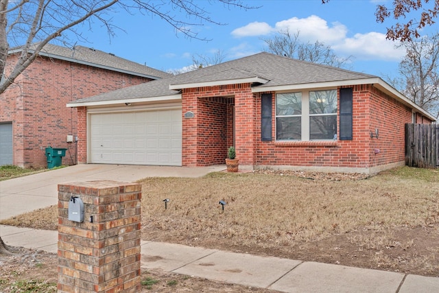 view of front of home featuring a garage and a front lawn