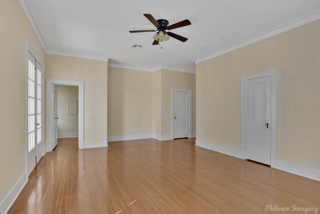 empty room featuring crown molding, ceiling fan, and light wood-type flooring