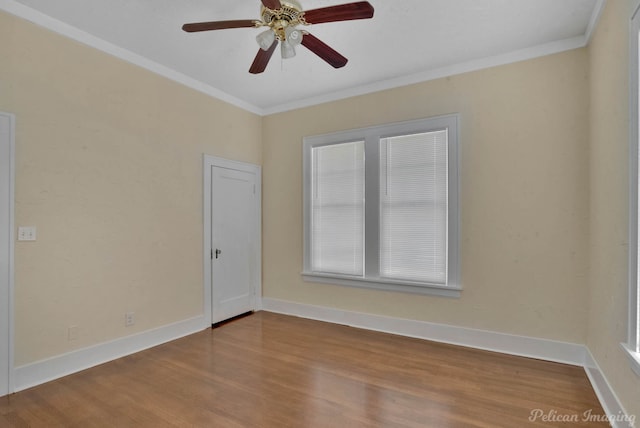 unfurnished room with ornamental molding, hardwood / wood-style floors, and ceiling fan