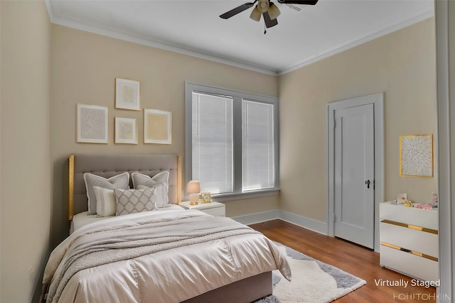 bedroom with ceiling fan, ornamental molding, and wood-type flooring