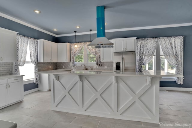 kitchen with white cabinetry, stainless steel refrigerator with ice dispenser, a center island, and pendant lighting