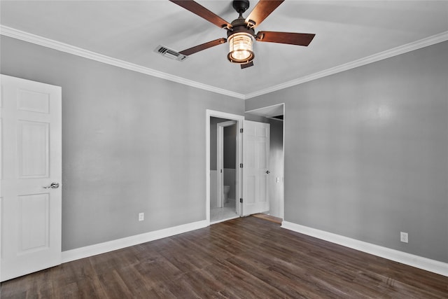 unfurnished bedroom featuring dark hardwood / wood-style flooring, ceiling fan, and crown molding